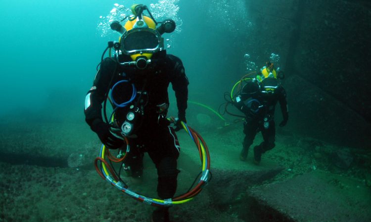 110629-N-XD935-058
VALPARAISO, Chile (June 29, 2011) Petty Officer 2nd Class Roprigo Fuentas, right, and 2nd Sgt. Bernardo Alcaide, navy divers assigned to the Chilean Buzo Salvatoaja, walk along the ocean floor during diving operations. Mobile Diving and Salvage Unit (MDSU) 2, Company 2-3, is participating in Navy Diver-Southern Partnership Station is a multinational partnership engagement intended to increase interoperability and partner nation capacity through diving operations. (U.S. Navy photo by Mass Communication Specialist 1st Class Jayme Pastoric/Released)
